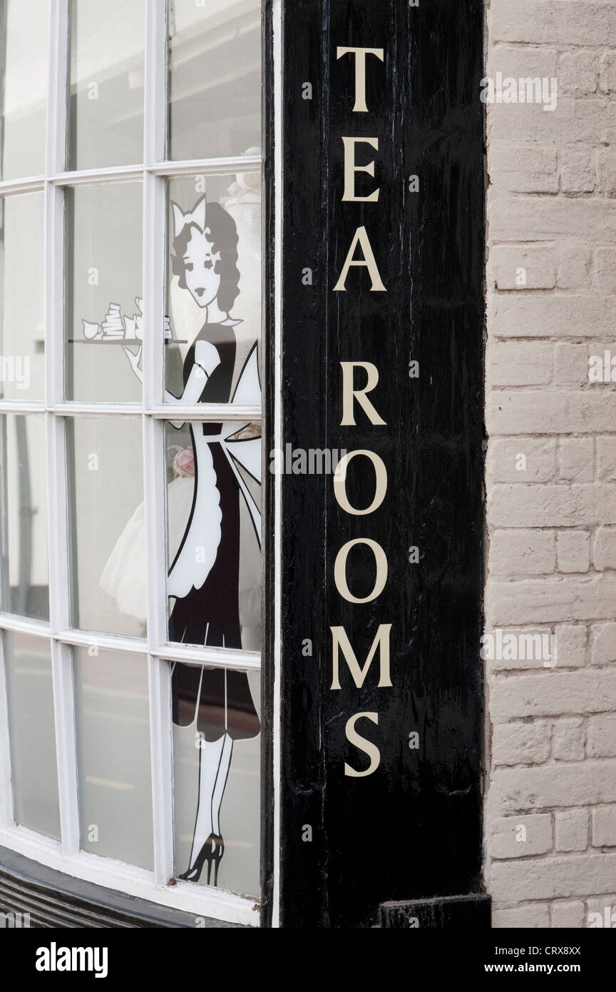 Old Fashioned Tea Rooms sign and an illustration of a waitress on the side of a Tea Room Cafe in Ditchling, East Sussex, UK Stock Photo