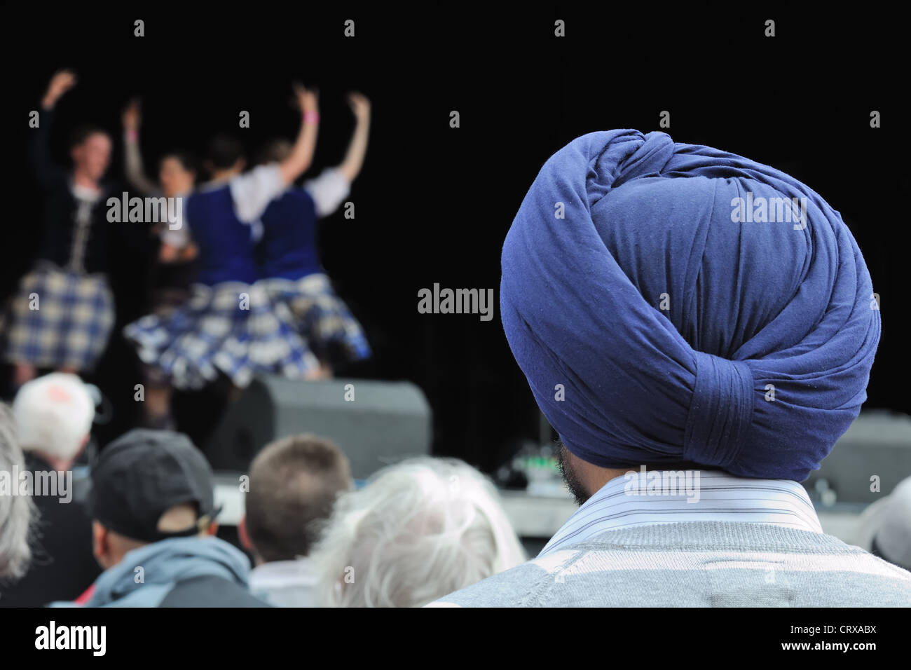Scottish Sikh watching the multi cultural Mela 2012 in Glasgow. Stock Photo
