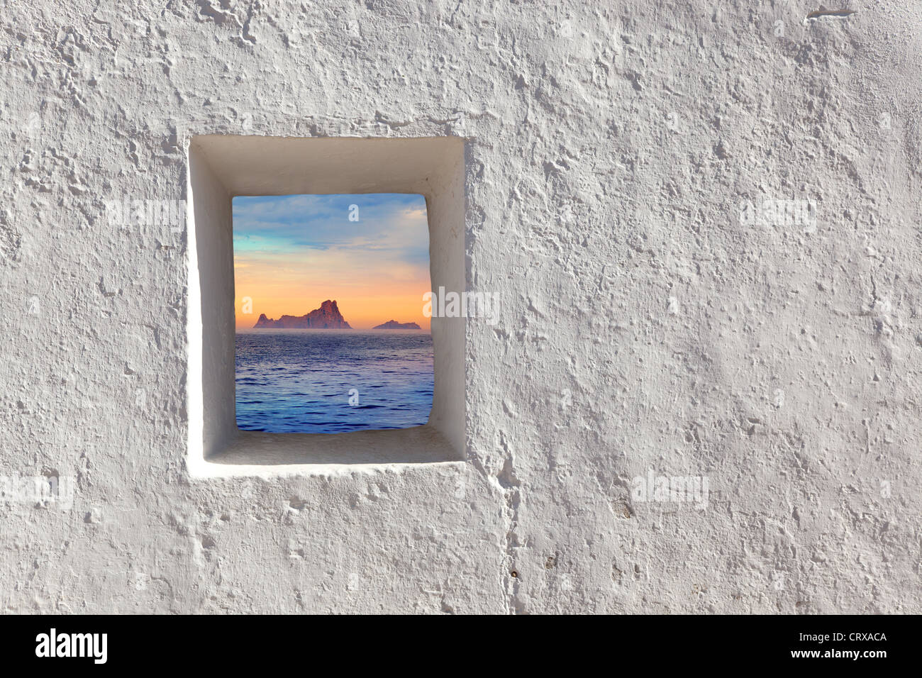 Balearic islands Es Vedra sunset view through whitewashed window Stock Photo