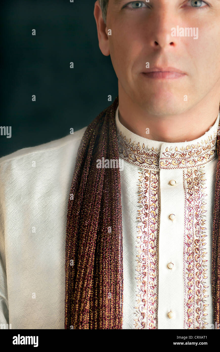 A close-up shot of a peaceful man in traditional Indian clothing. Stock Photo