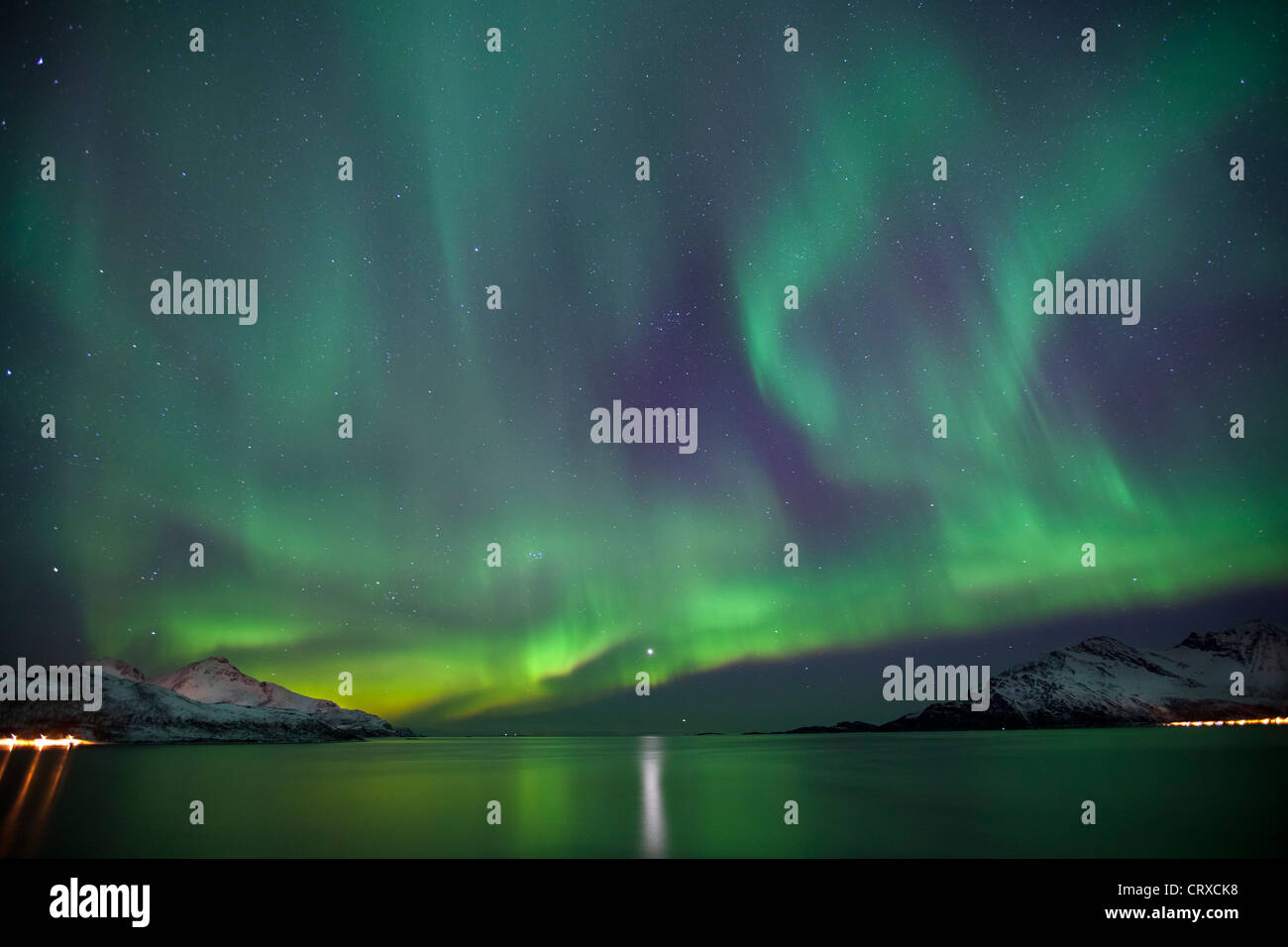 Aurora Borealis The Northern Lights fill the sky at Kvaloya in the Arctic Circle near Tromso, Northern Norway Stock Photo