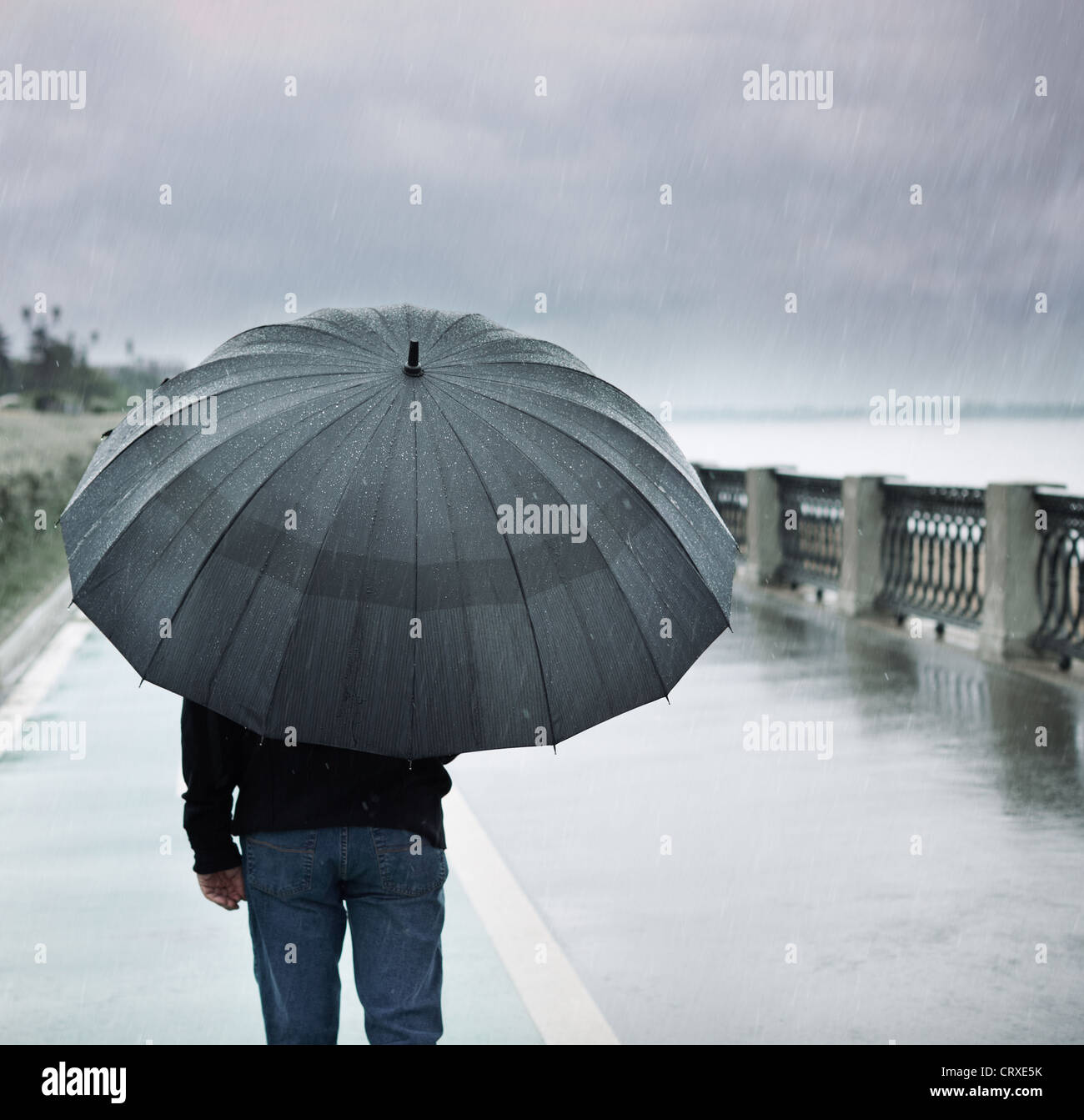 man with umbrella Stock Photo - Alamy