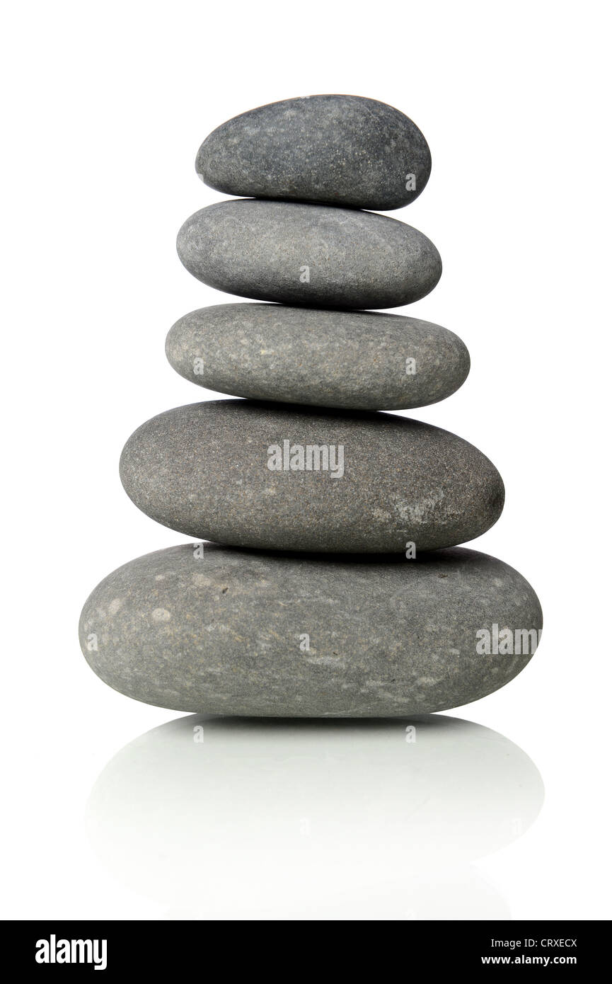 Black stones stacked together isolated over white background Stock
