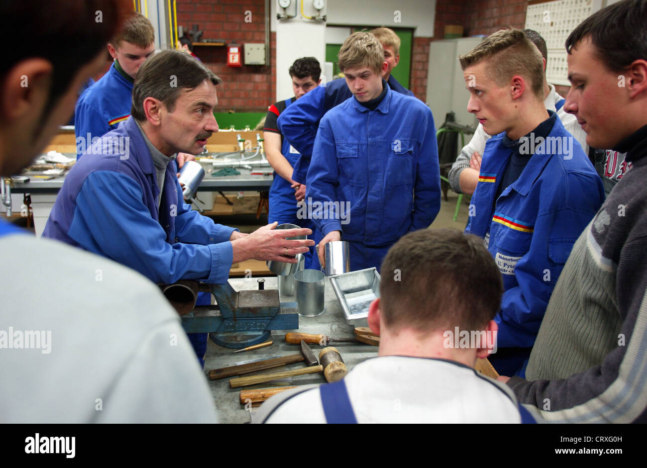 Trainees as a plant mechanic Stock Photo - Alamy