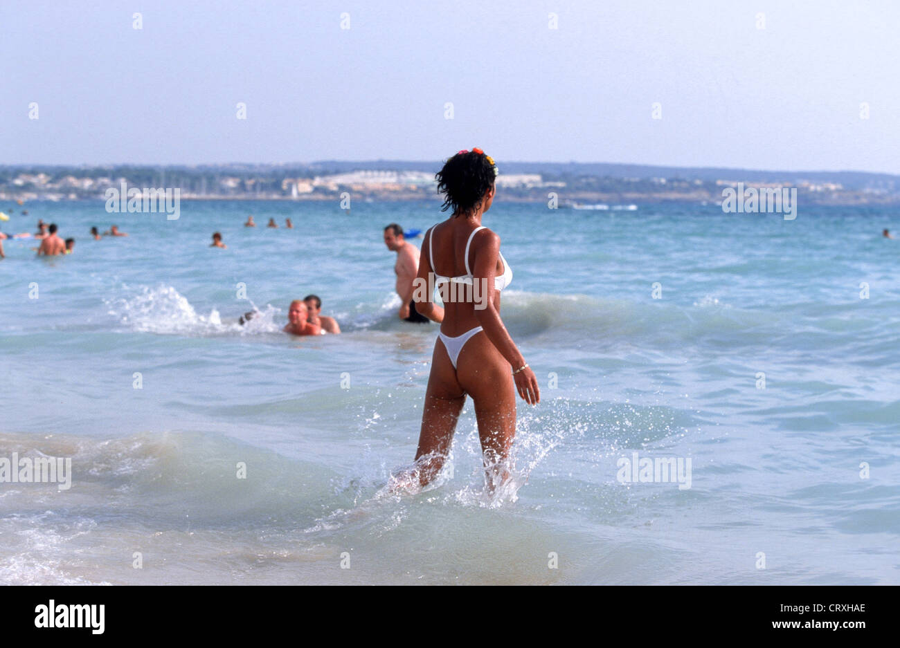 Spain, Mallorca, Dutche vacationer standing in water Stock Photo