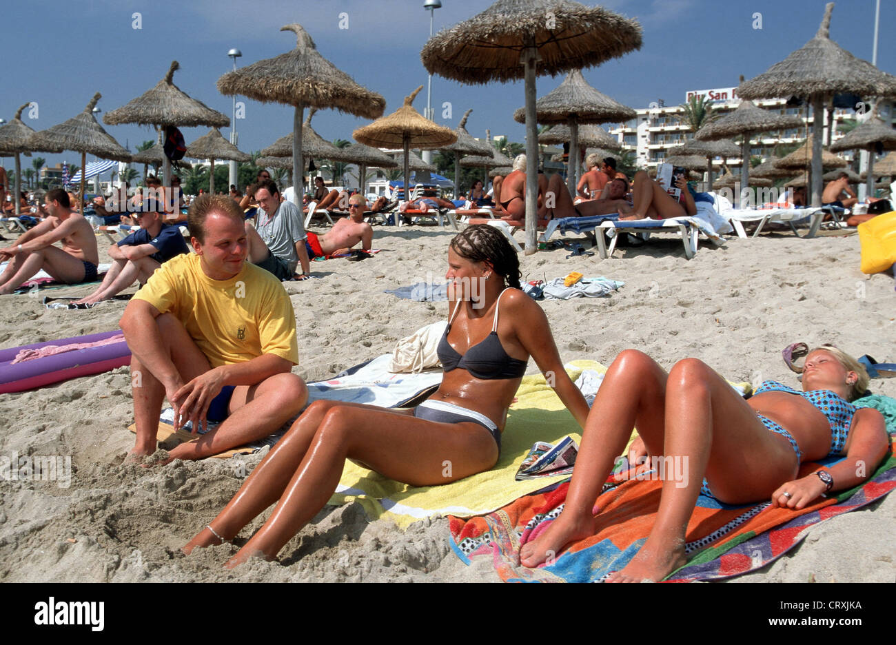 Spain, Mallorca, German tourists on the beach in the sun Stock Photo