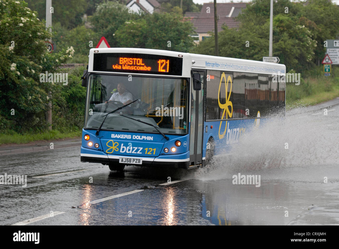 Motorists driving through the floods outside the Airport Tavern pub near Bristol Airport today during the wet weather. Stock Photo