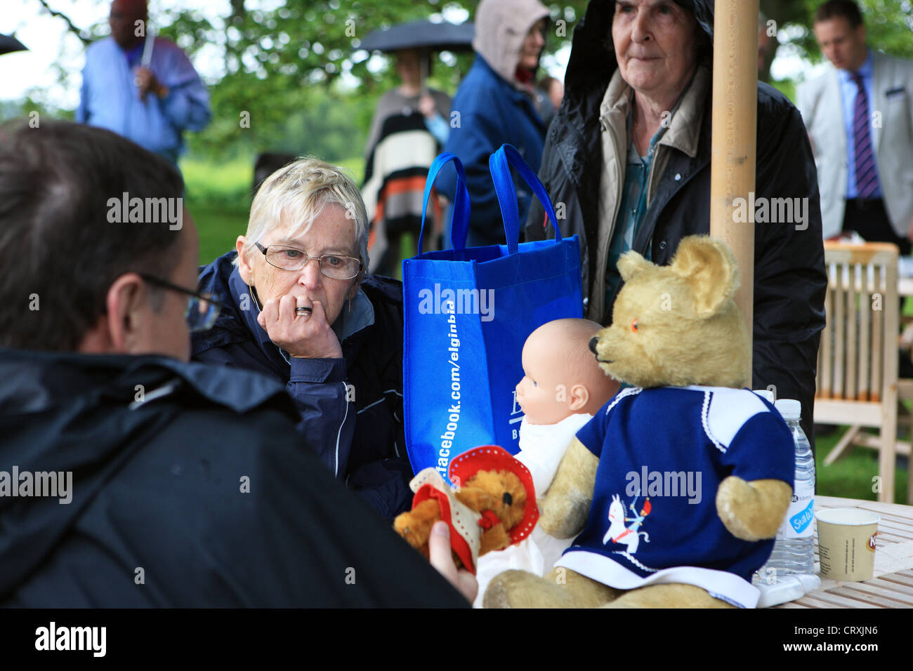 People getting advice on their teddies and doll at the Antiques Roadshow at Cawdor Castle near Inverness in Scotland June 2012 Stock Photo