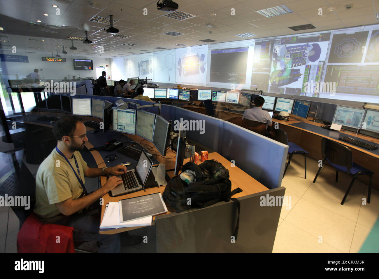 GENEVA, SWITZERLAND - June 2012: physicists work in the ATLAS particle detector control room at CERN, Geneva Stock Photo