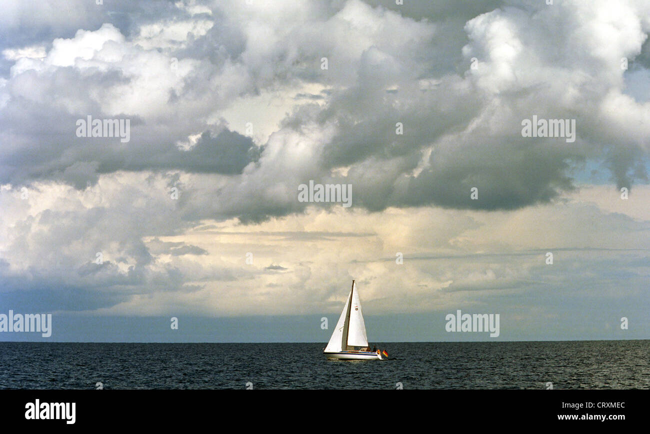 Sailboat and clouds Stock Photo