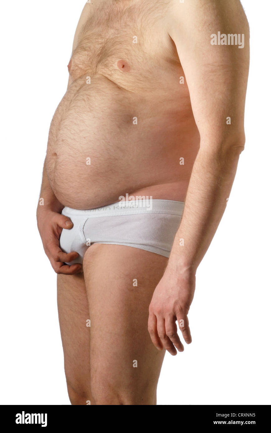 fat man in white underwear is holds the sex Stock Photo