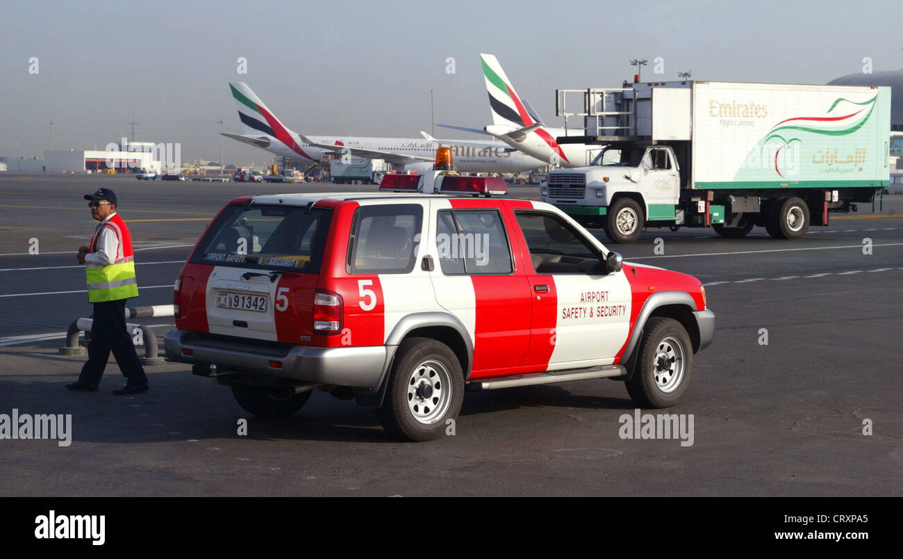 Vehicles and aircraft outside the airport of Dubai Stock Photo