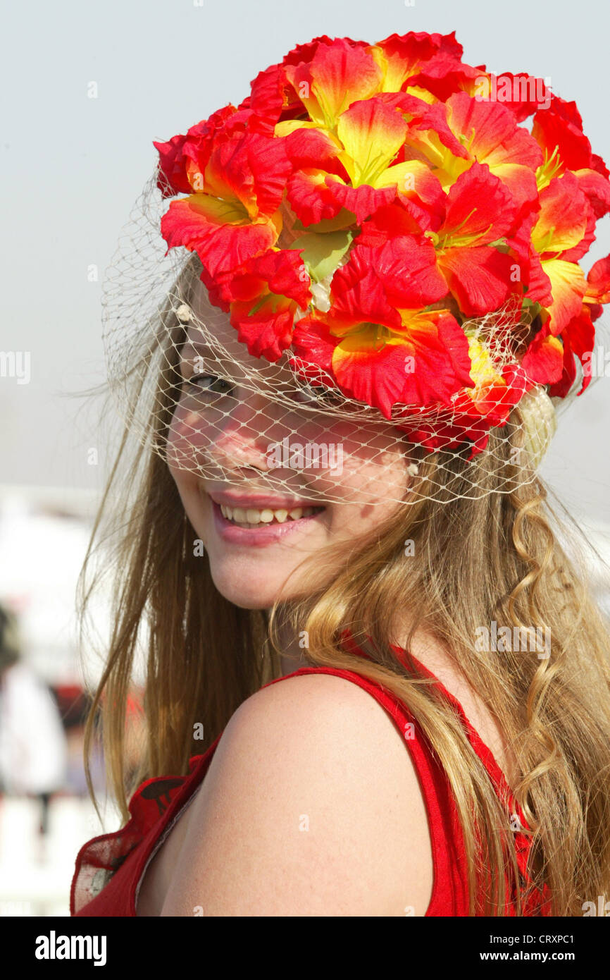 Viewers with hat on the Nad Al Sheba Racecourse in Dubai Stock Photo