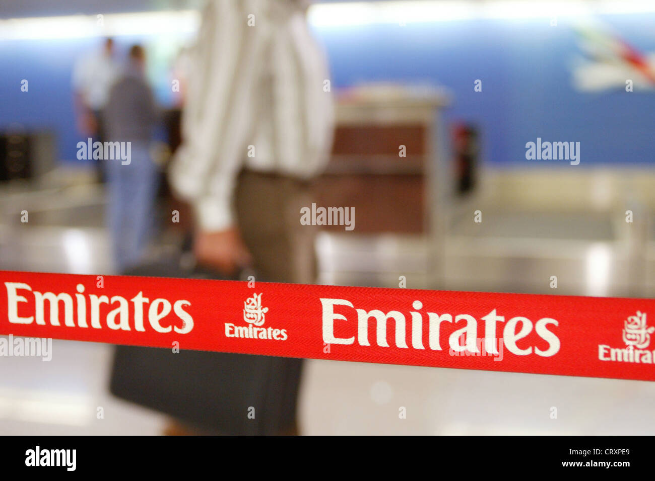 Check in at the counter of Emirates Airlines in Dubai airport. Stock Photo