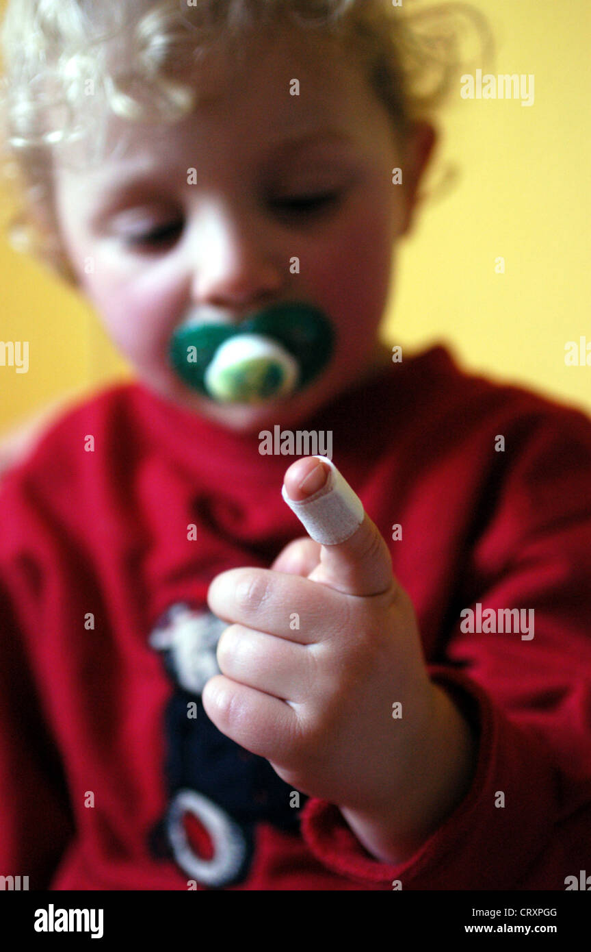 Child with plaster on his finger, Berlin Stock Photo - Alamy