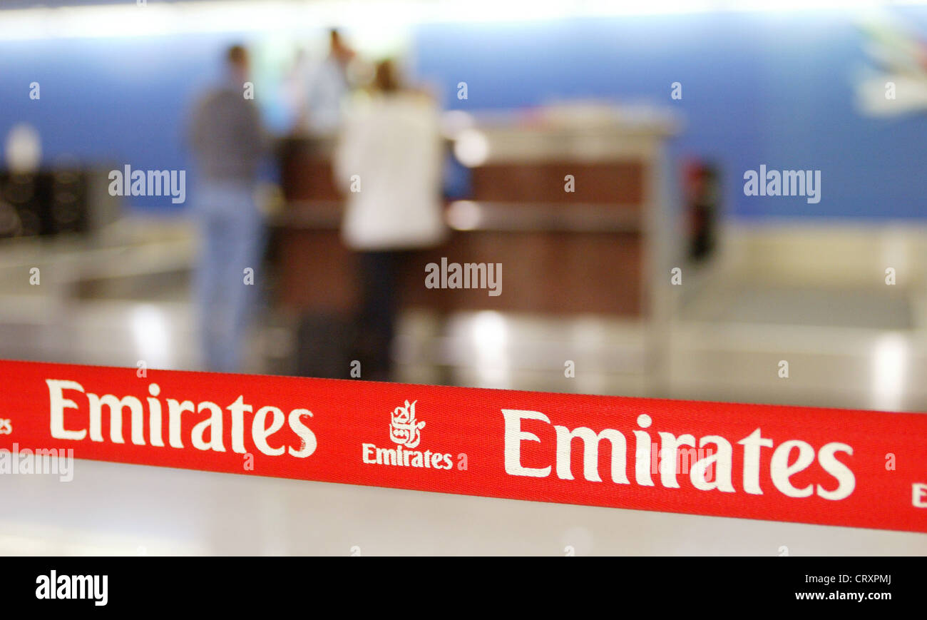 Check in at the counter of Emirates Airlines in Dubai airport. Stock Photo