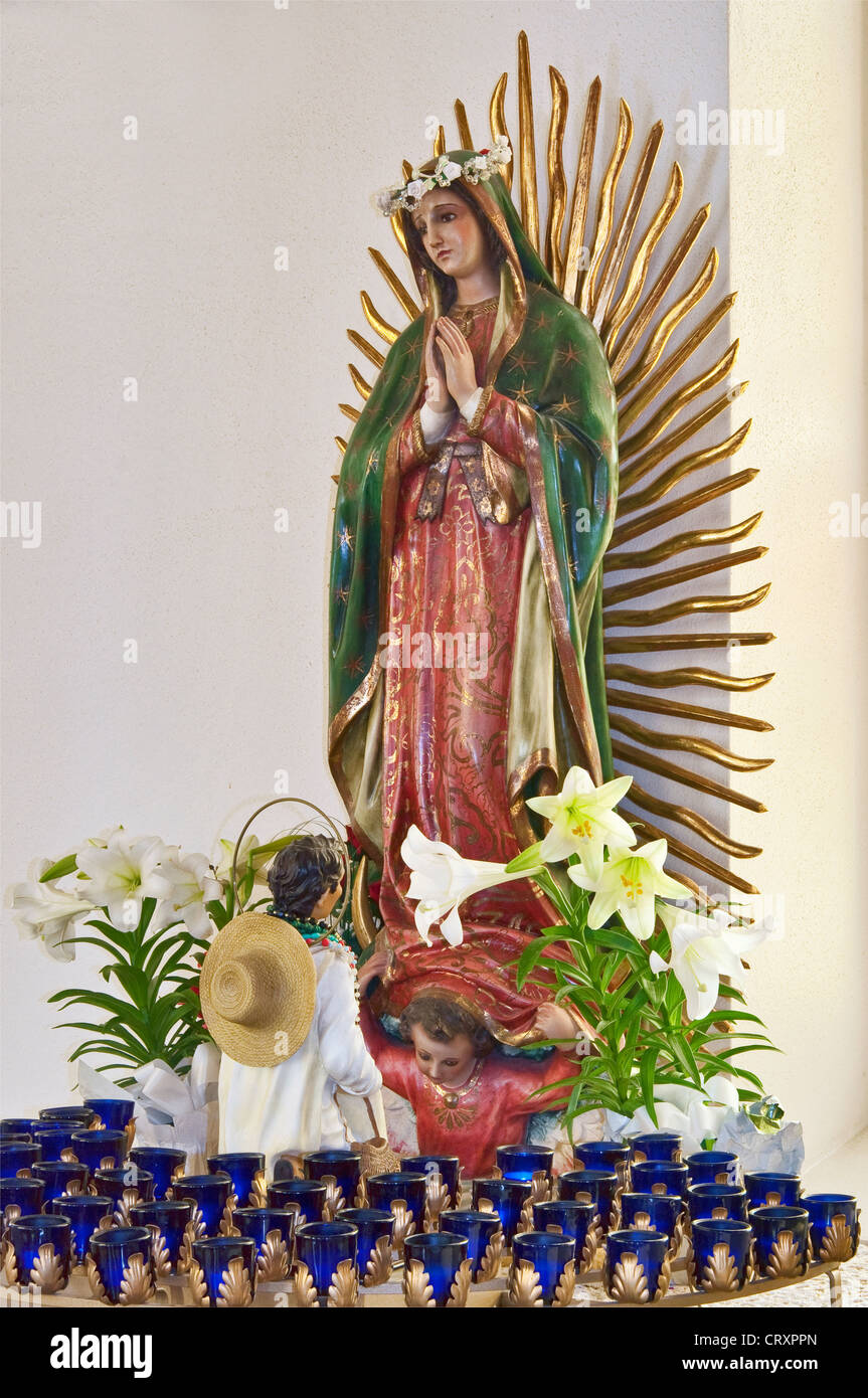 Our Lady of Guadalupe, wooden statue in St. Louis Catholic Church, built 1870, in Castroville, Texas, USA Stock Photo