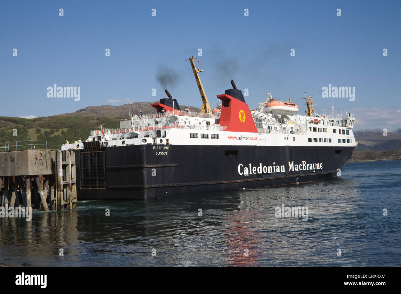 Ullapool Ross and Cromarty Scotland May Calmac ferry from Isle of Lewis on Loch Broom reversing in harbour of small fishing port Stock Photo