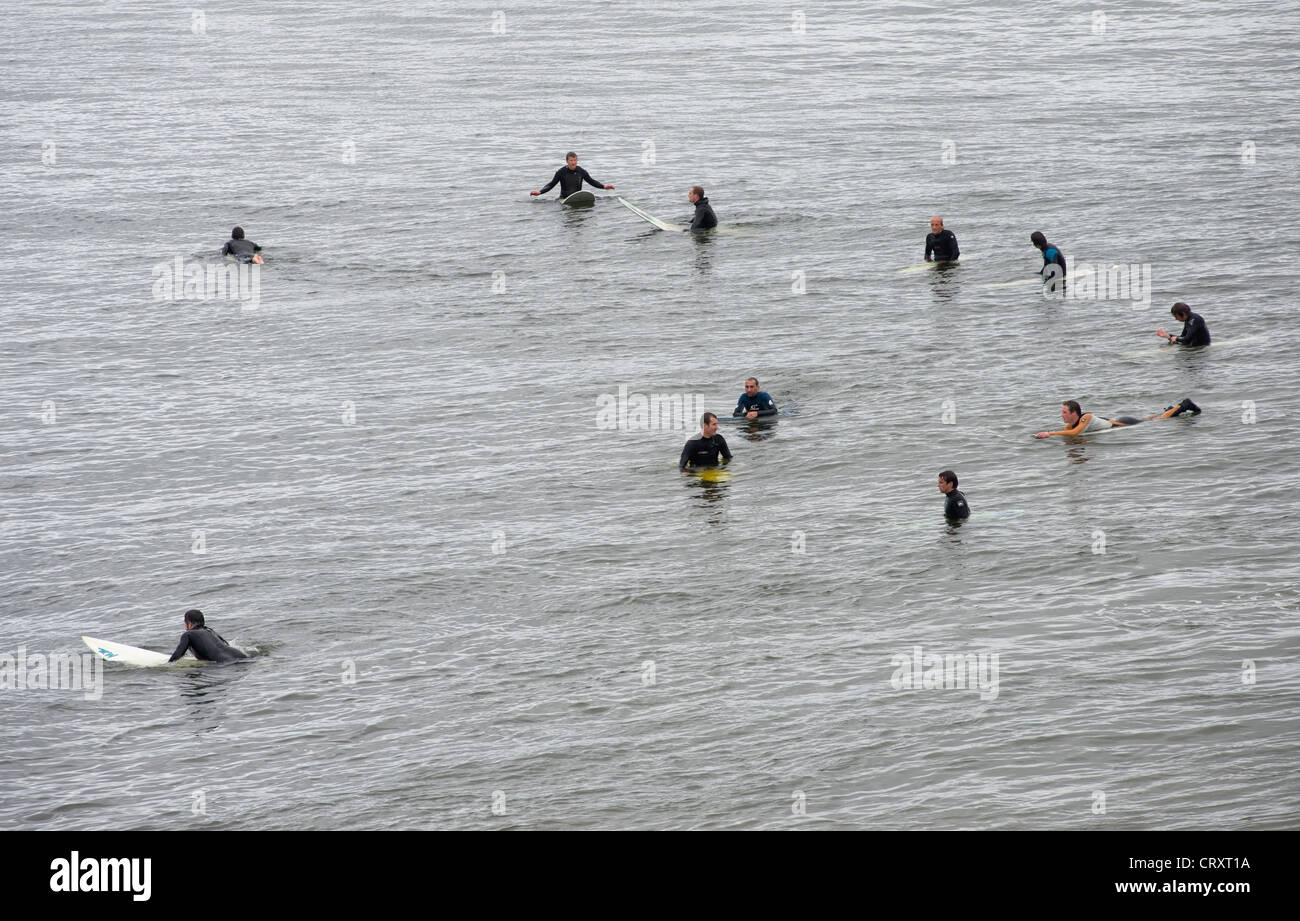 Surfers waiting for a break, Bundoran, Donegal. Stock Photo