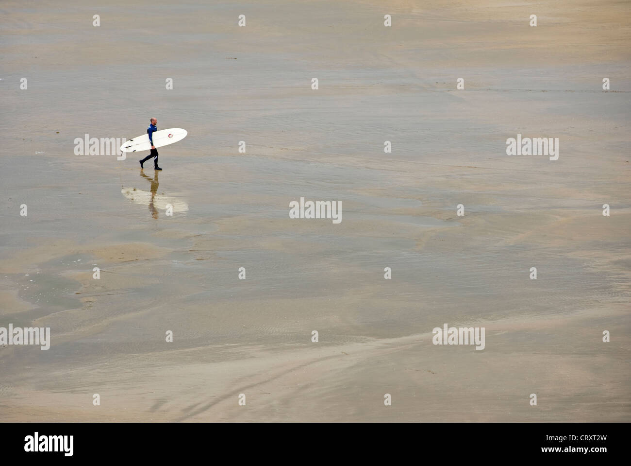 Solitary surfer on the beach at Bundoran, County Donegal. Stock Photo
