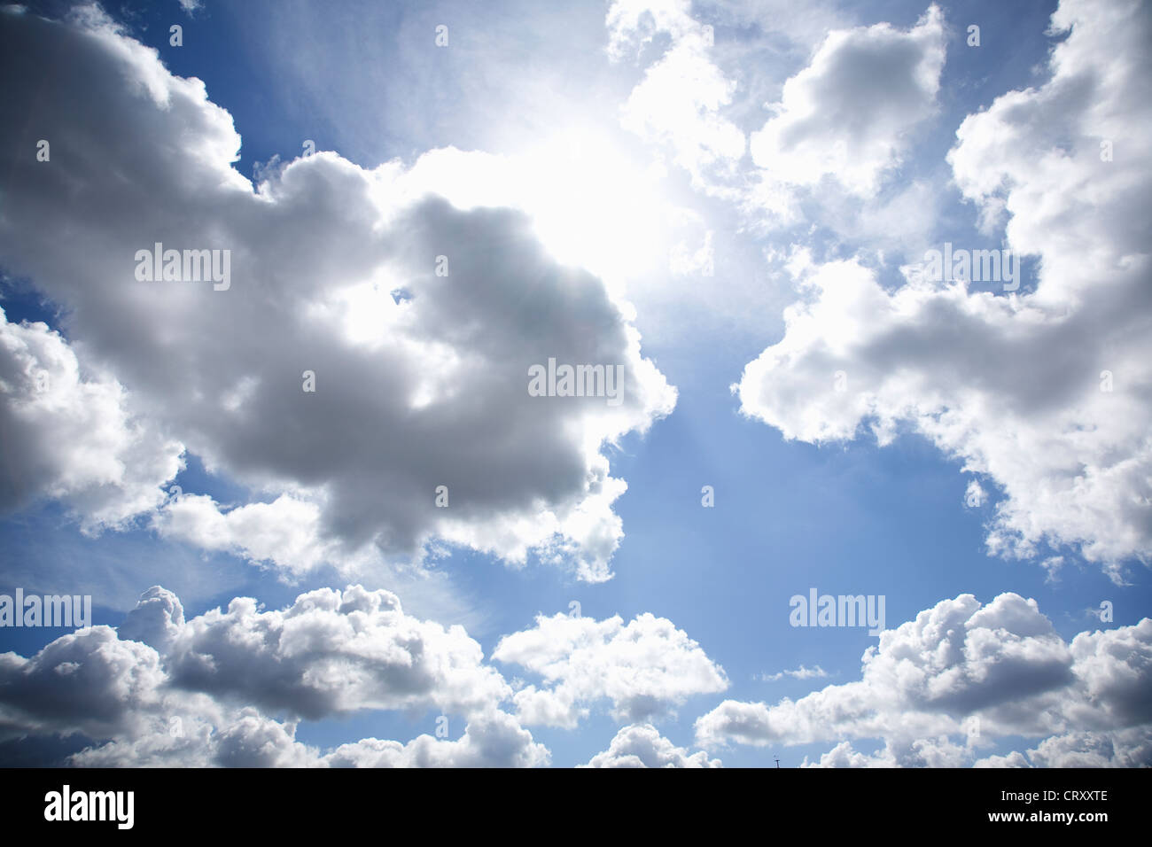 The Sun behind White and grey clouds Stock Photo Alamy