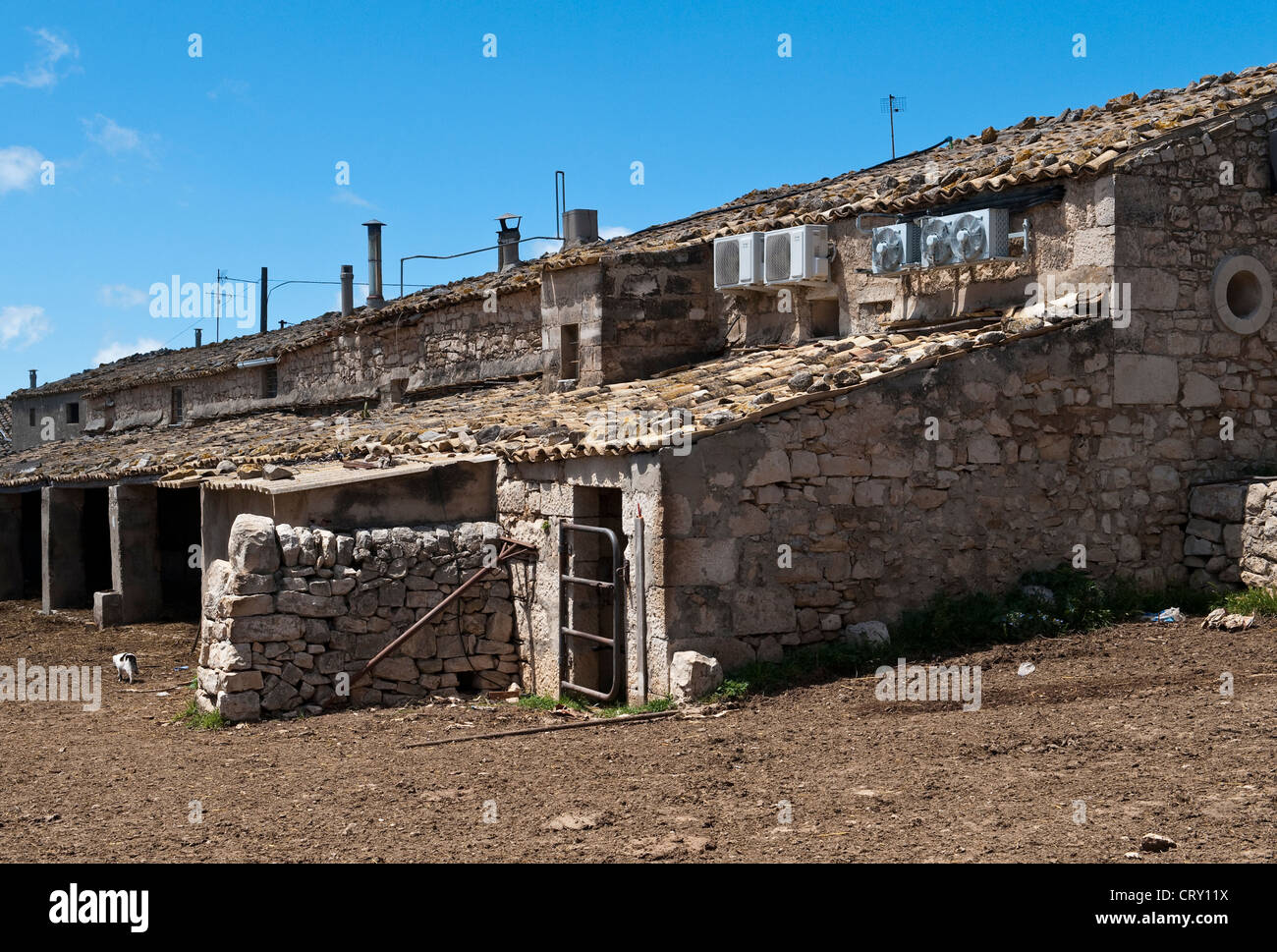 Old rustic farm cottages fitted with modern air conditioning at Donnafugata, Sicily, Italy Stock Photo