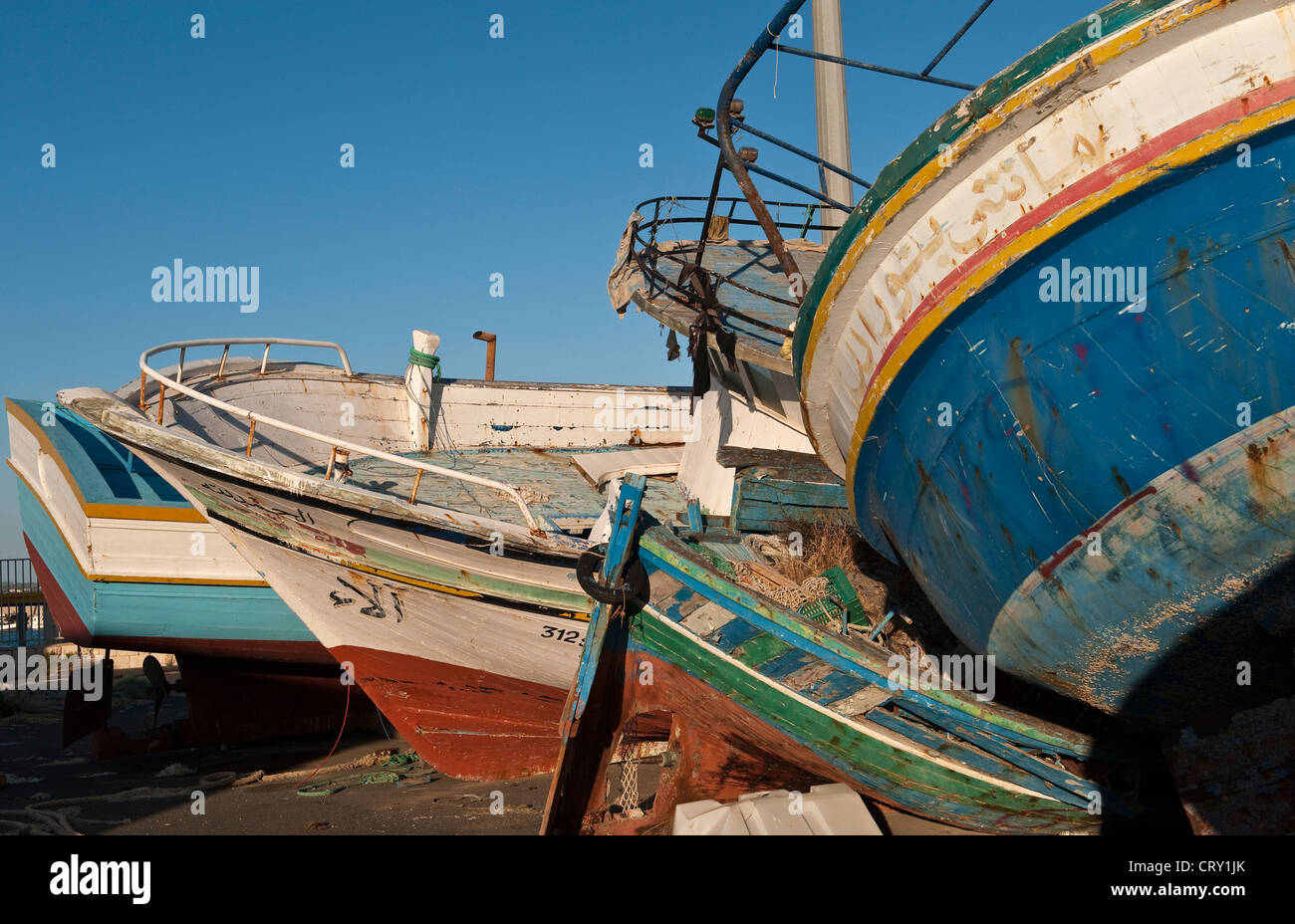 Old fishing boats used by refugees to cross the Mediterranean from