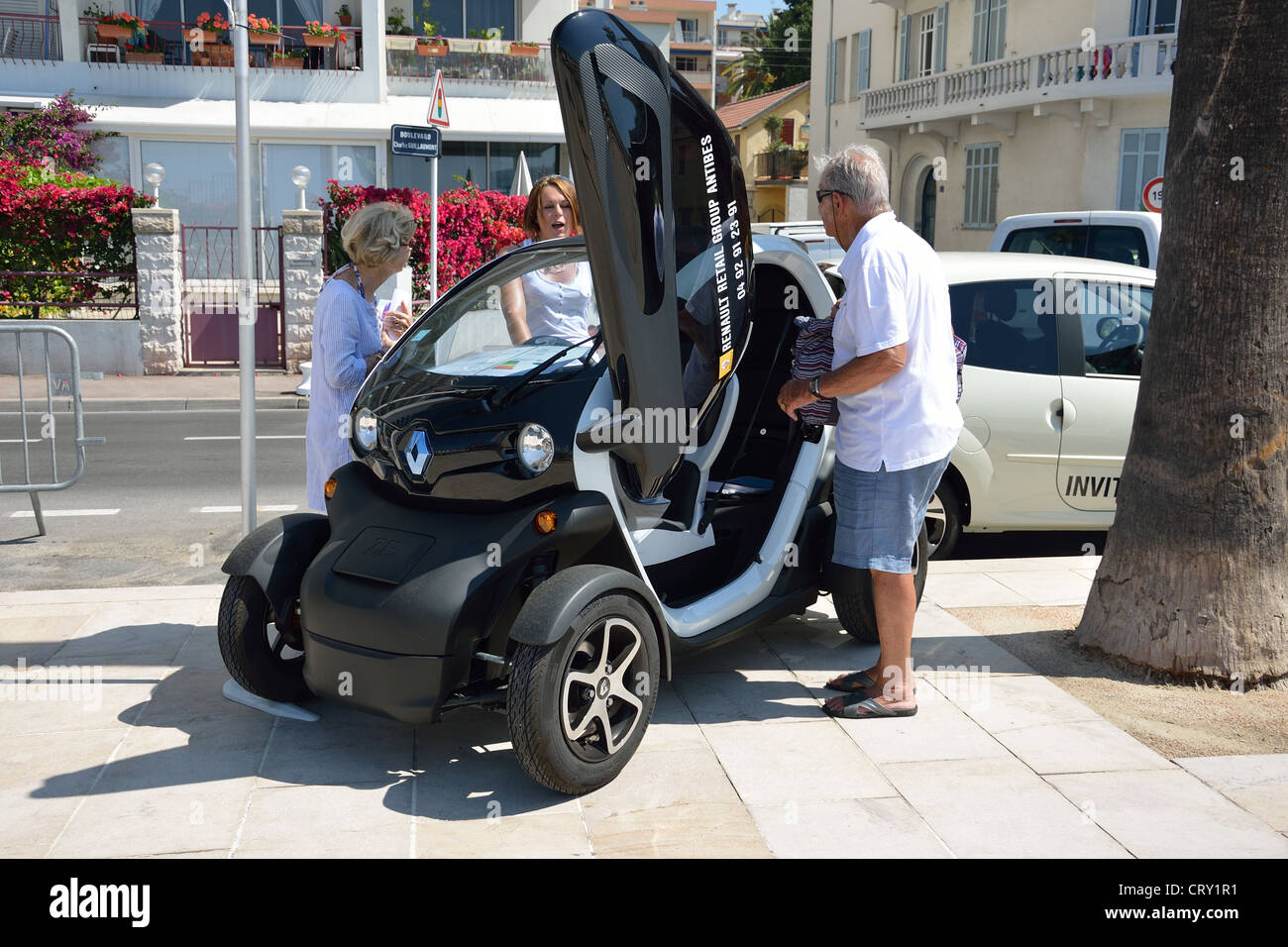 Renault electric quadricycle car on seafront, Juan-les-Pins, Côte d'Azur, Alpes-Maritimes, Provence-Alpes-Côte d'Azur, France Stock Photo