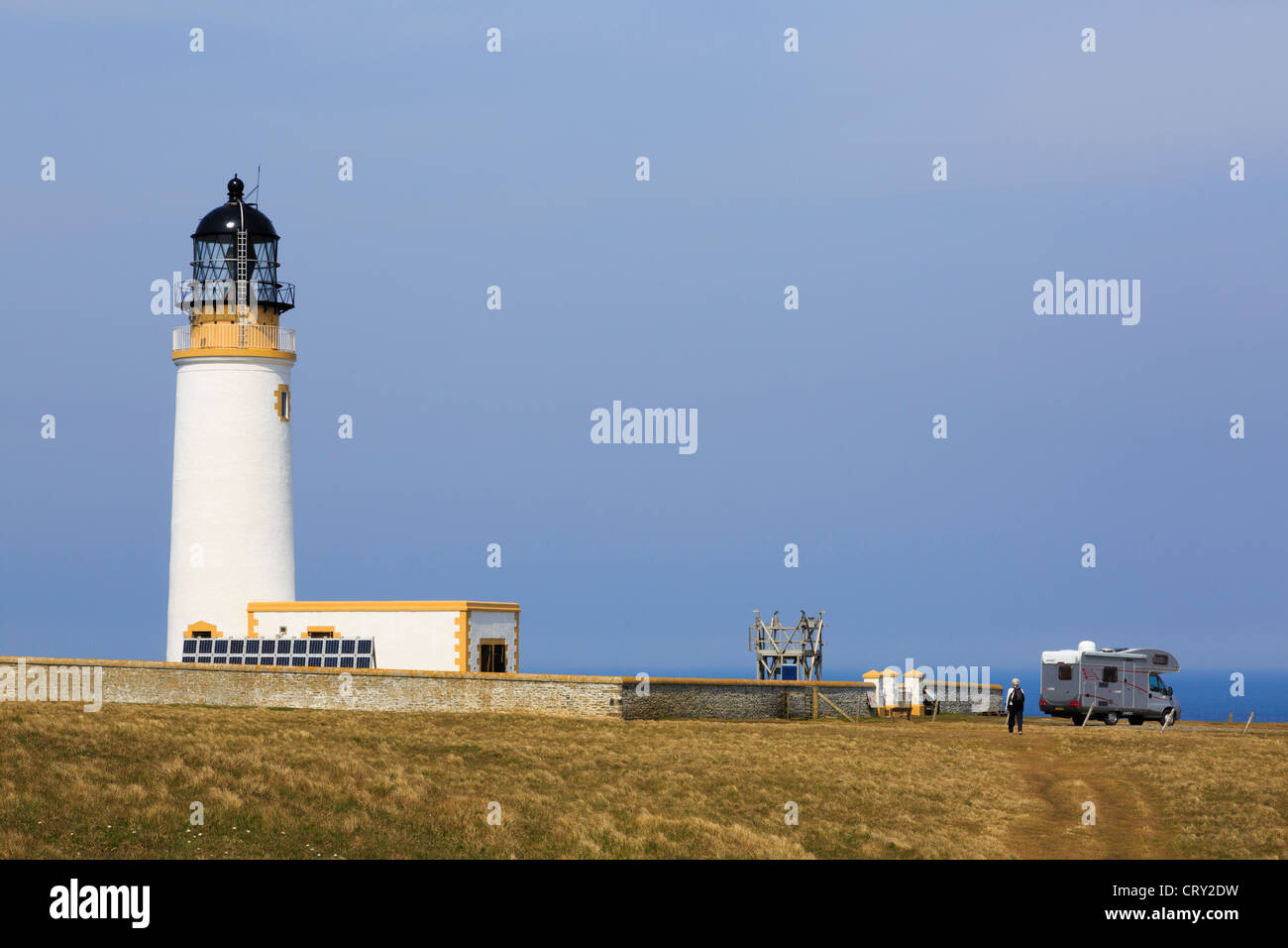 Motorhome by lighthouse built on headland to warn ships off North Shoal at Noup Head Westray Island Orkney Islands Scotland UK Stock Photo