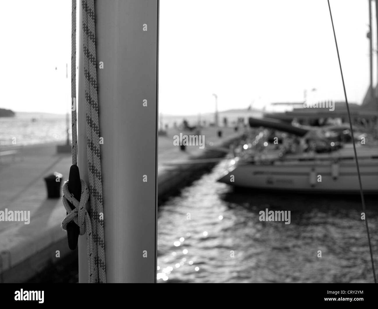 Image of marina with boats taken from a boat - black and white photography Stock Photo