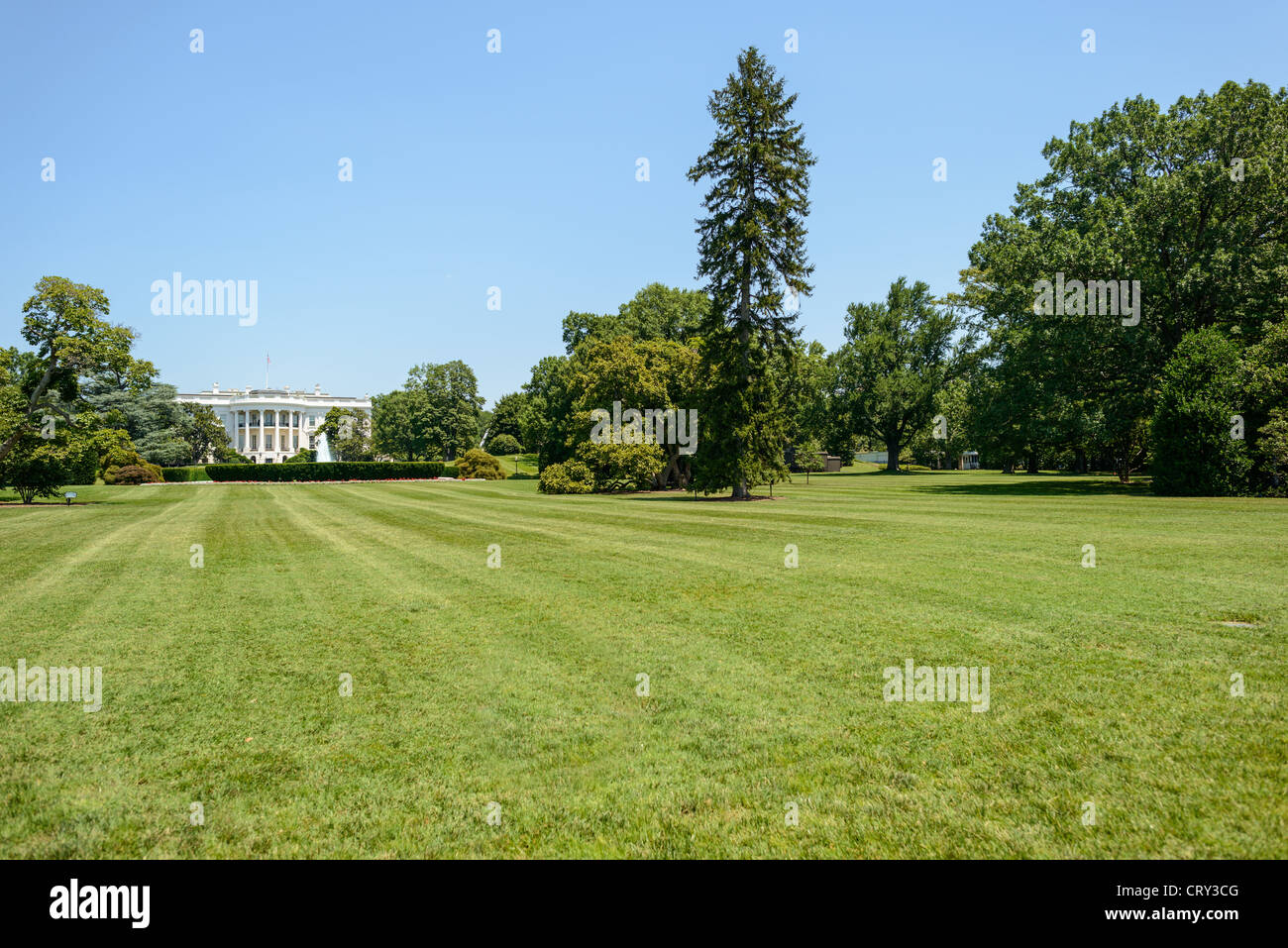 WASHINGTON, D.C., United States — The White House, the official residence and workplace of the President of the United States, stands prominently at 1600 Pennsylvania Avenue NW. This iconic neoclassical building has been the home of every U.S. president since John Adams in 1800. It is a symbol of the American presidency and a major landmark in the nation's capital. Stock Photo