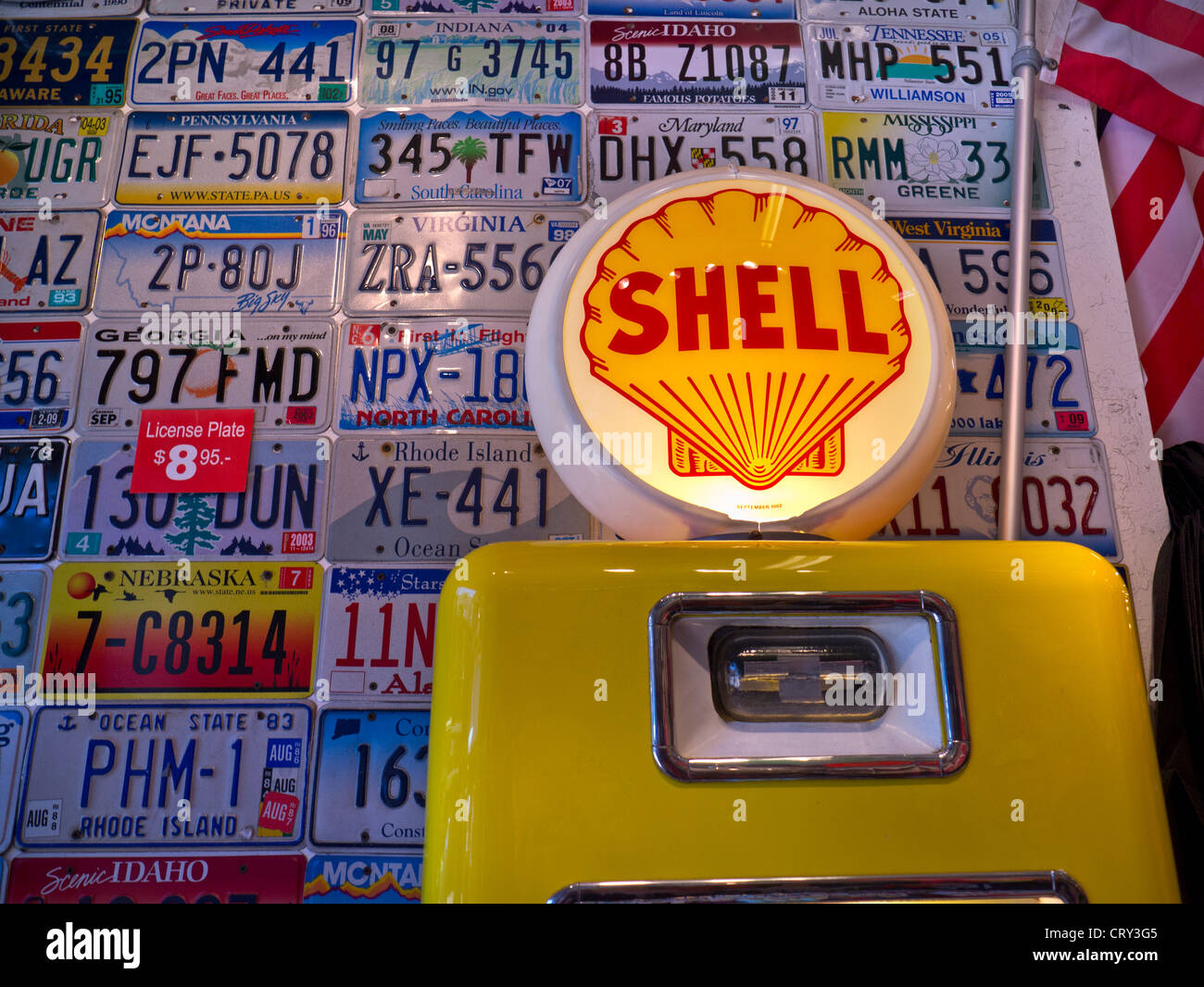 Shell petrol pump and US car plates form eye catching display at entrance to car accessories store Pier 39 San Francisco USA Stock Photo