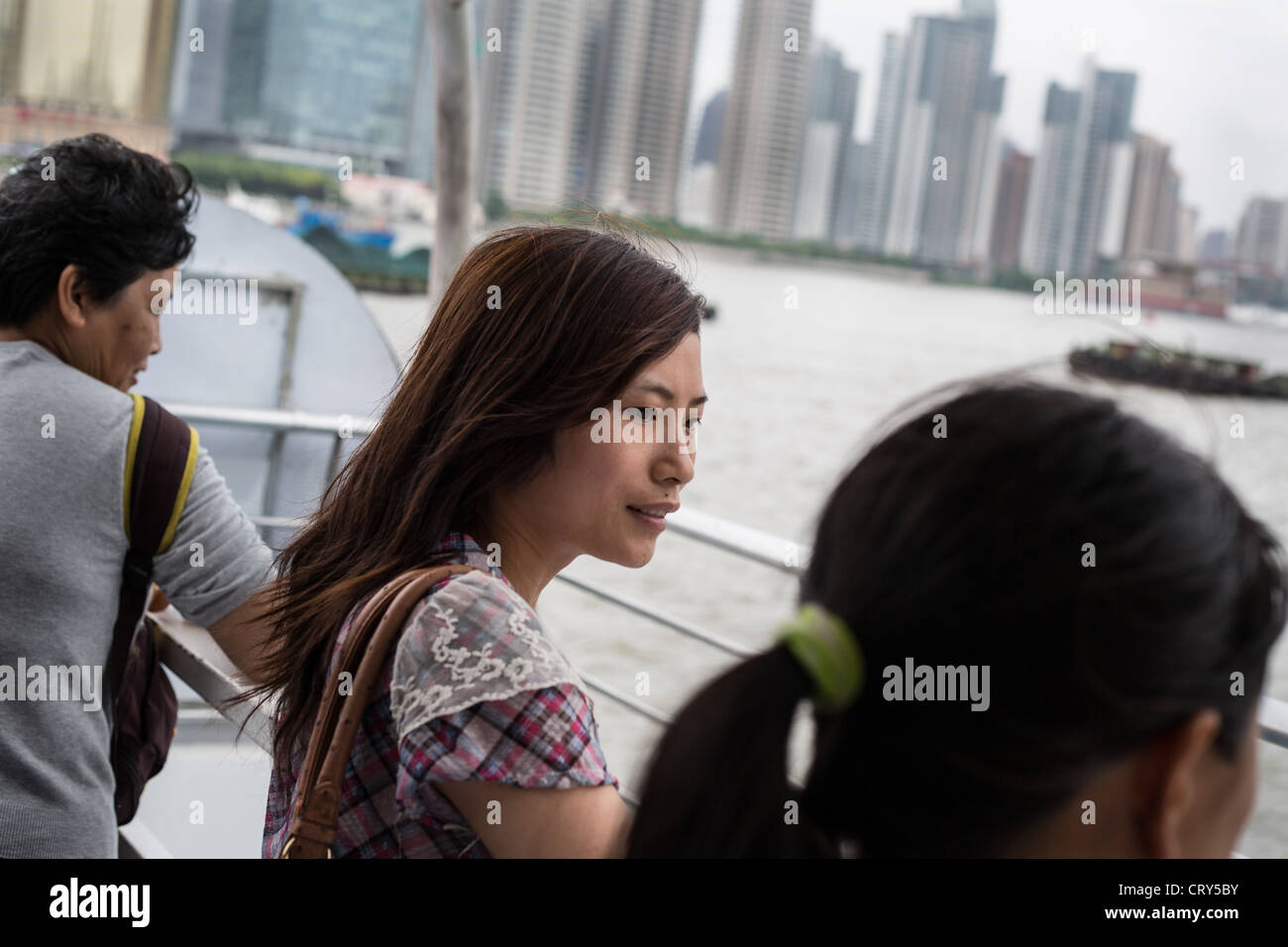 Chinese woman on a ferry on the Huangpu River, in Shanghai, China Stock ...