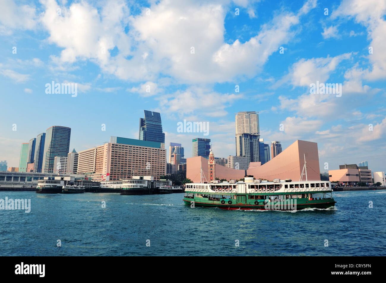 Urban architecture in Hong Kong Victoria Harbor in the day with blue