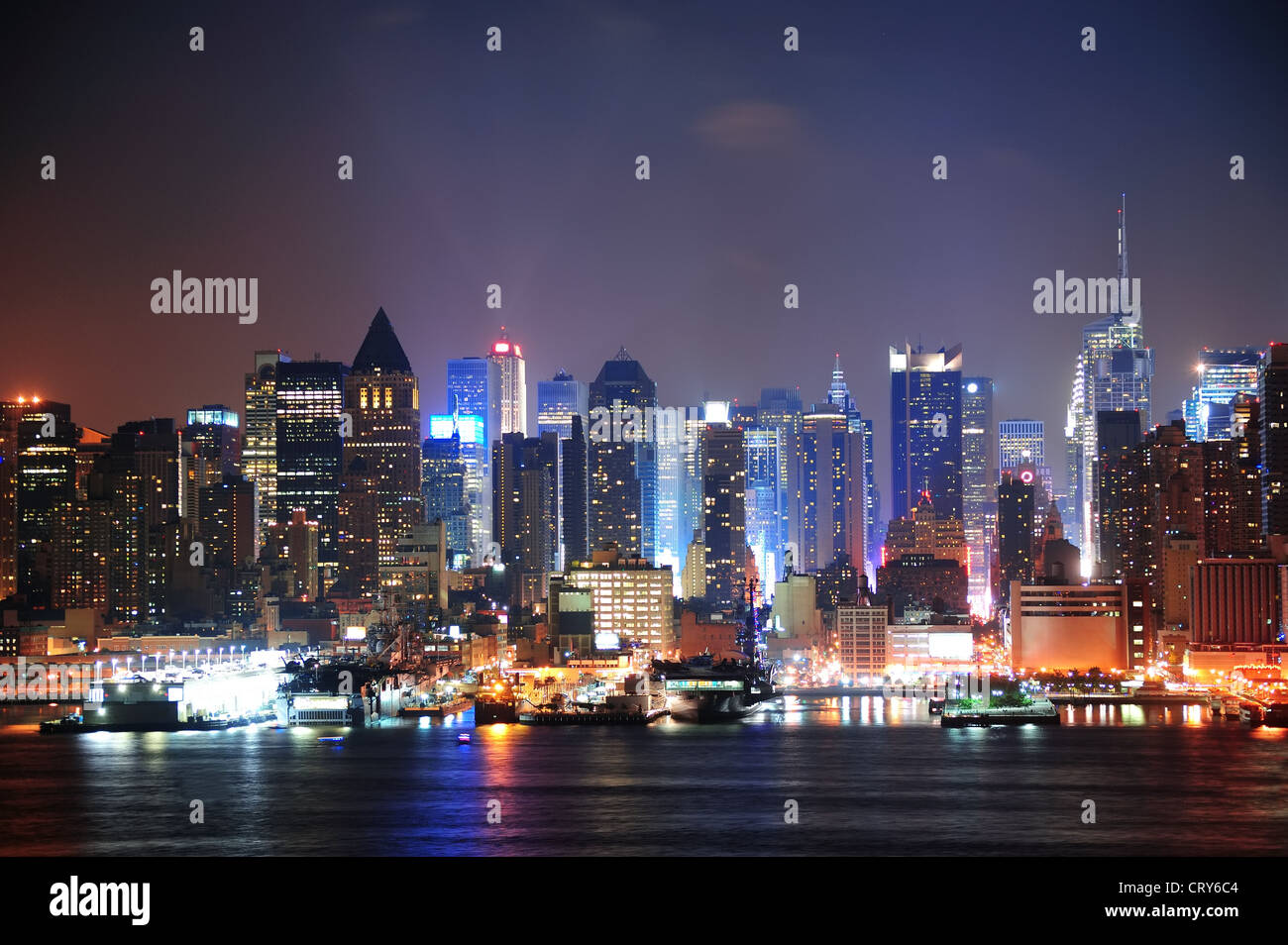 New York City Manhattan midtown skyline at night with skyscrapers lit ...