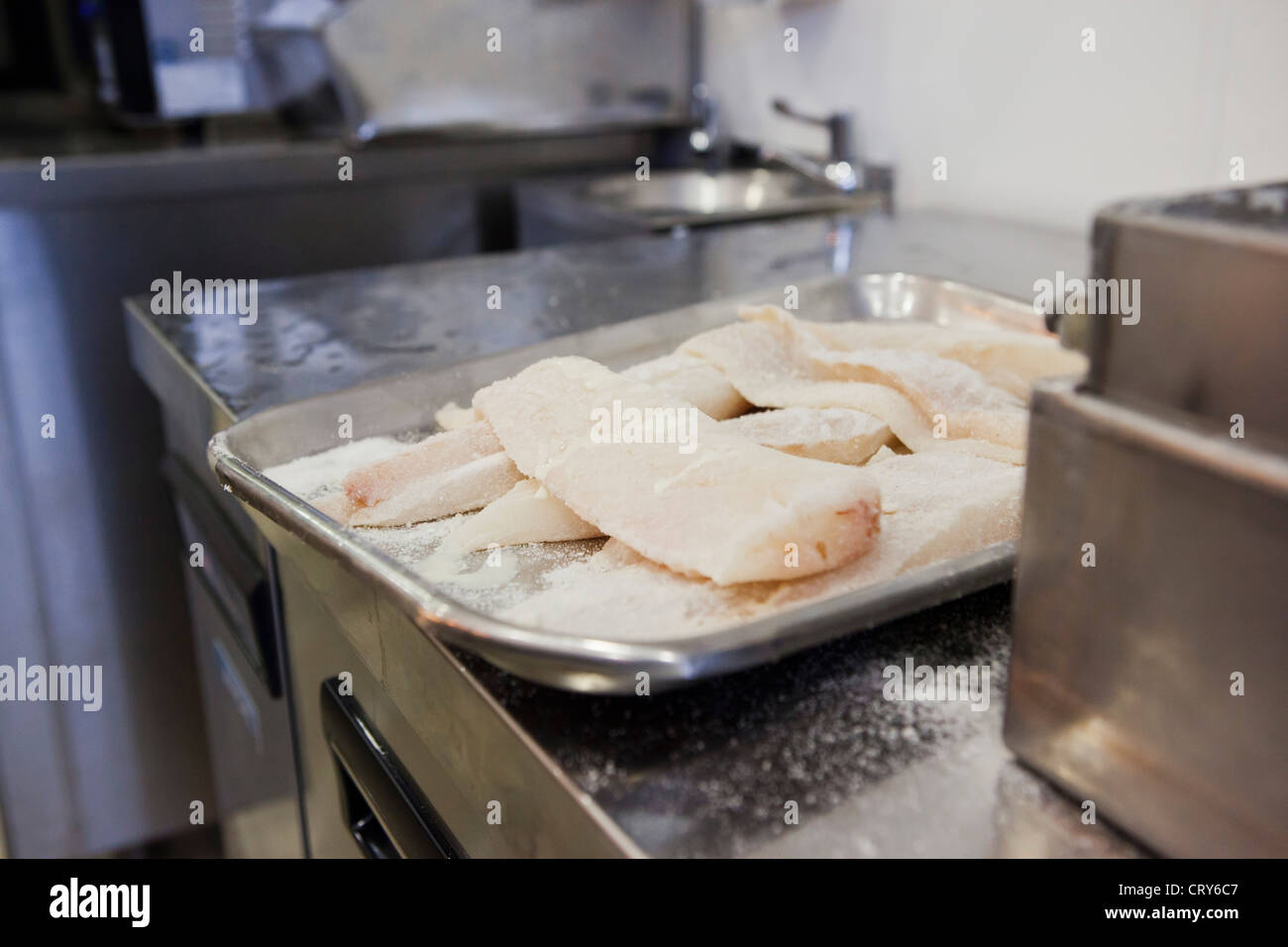 Cod fillets waiting to be battered in British chip shop Gloucestershire, UK Stock Photo
