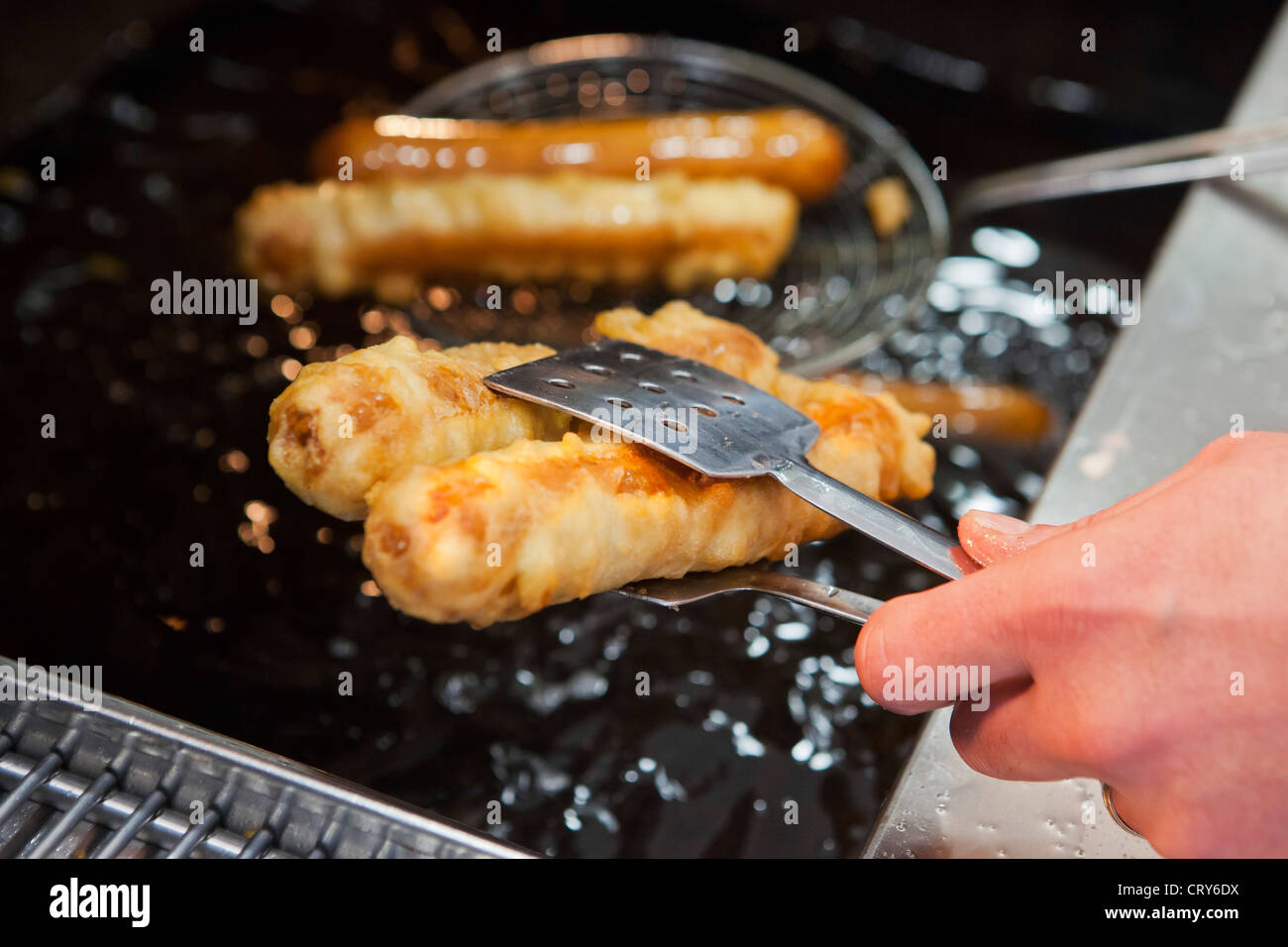 Fried battered sausage from traditional British chip shop Stock Photo