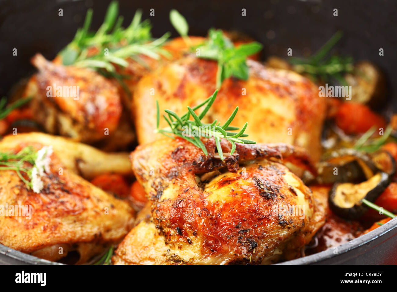 Tasty grilled chicken with vegetable and herbs Stock Photo