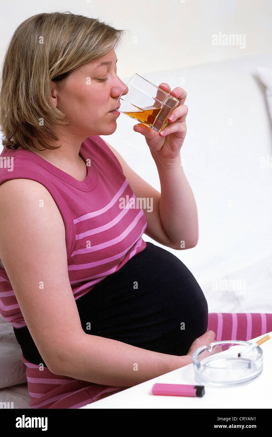 PREGNANT WOMAN DRINKING Stock Photo Alamy