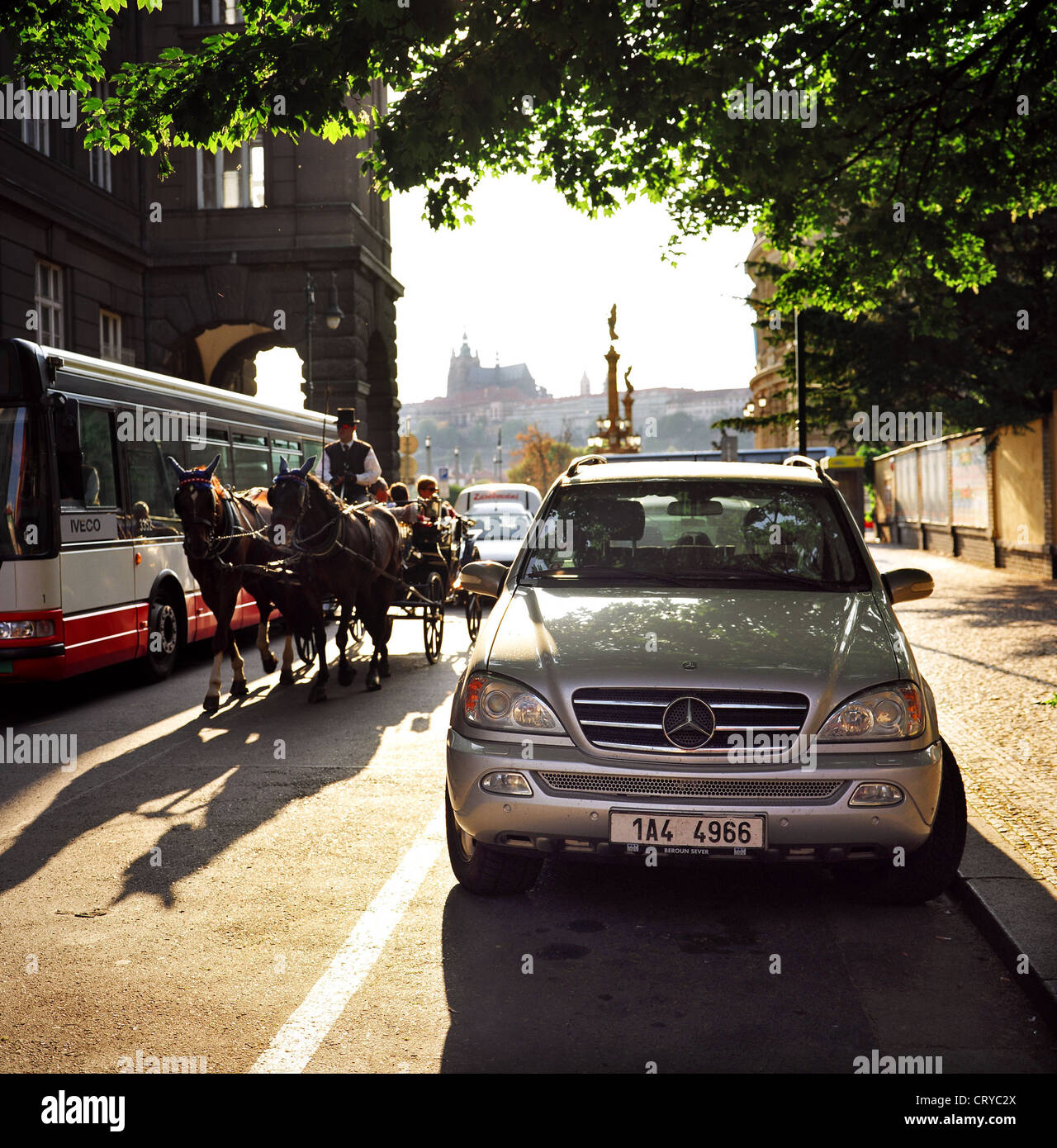 Prague, team of horses and Mercedes terrain vehicle in the Old Town Stock Photo