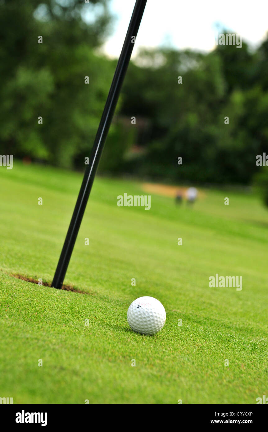 golf ball and hole Stock Photo Alamy