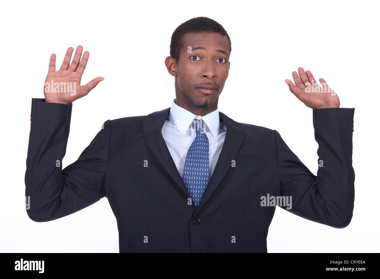 Businessman in a suit holding his hands in the air Stock Photo - Alamy