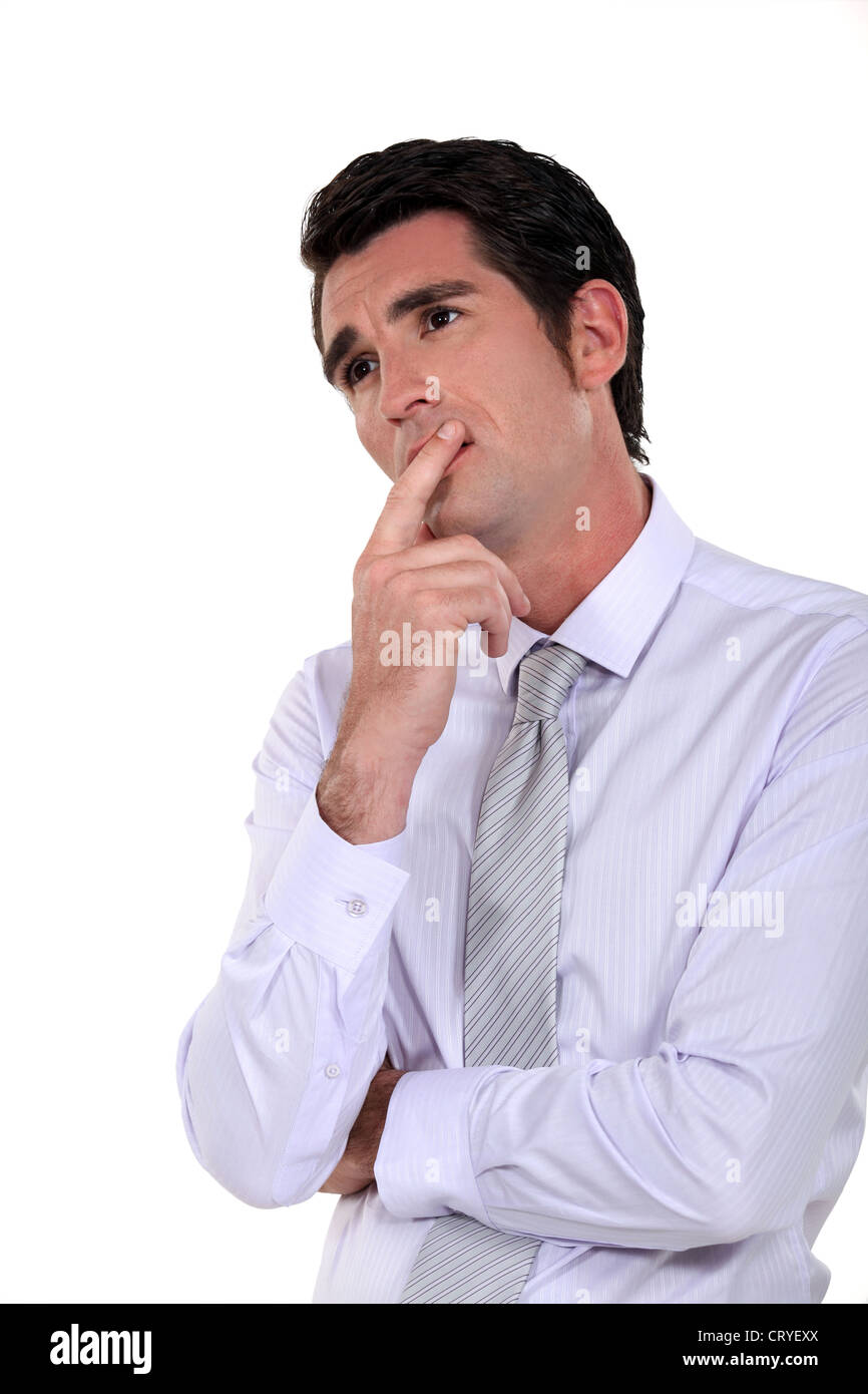 Businessman deep in thought Stock Photo - Alamy