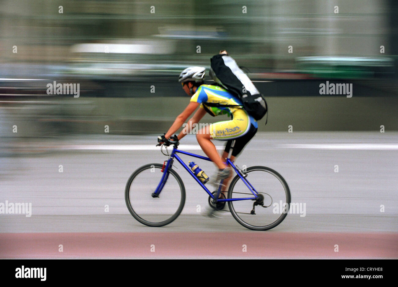 Athletic cyclist in city traffic Stock Photo Alamy