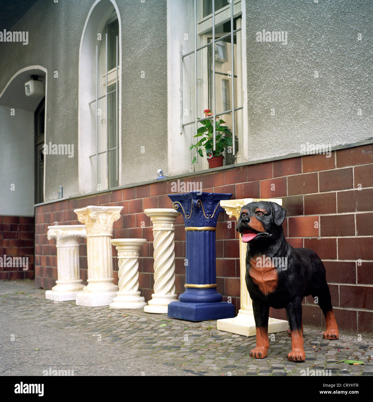 Berlin Pillars And Dog Figure Made Of Plastic In Front Of A