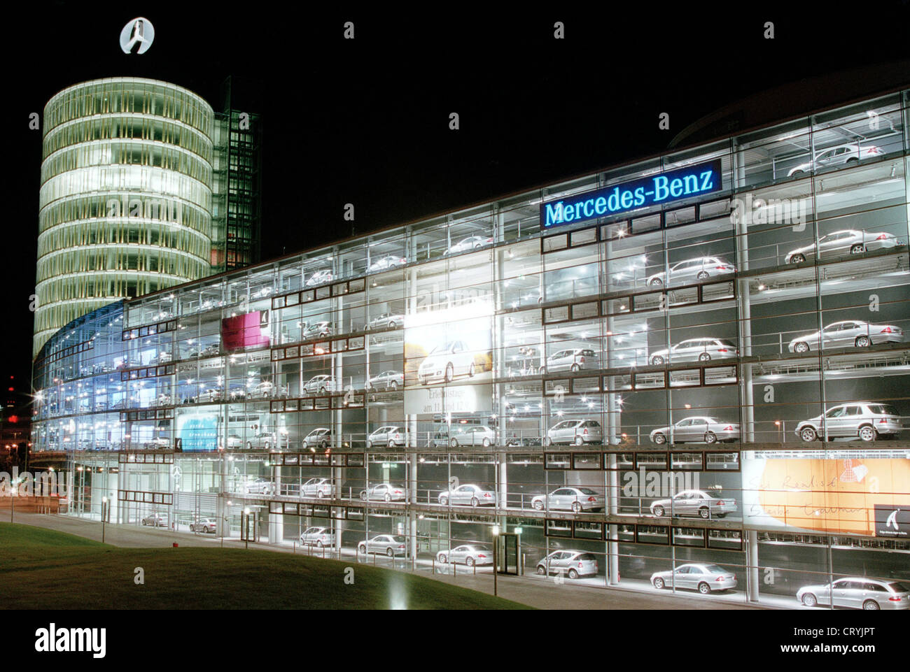 The Mercedes Benz dealership in Munich at night Stock Photo