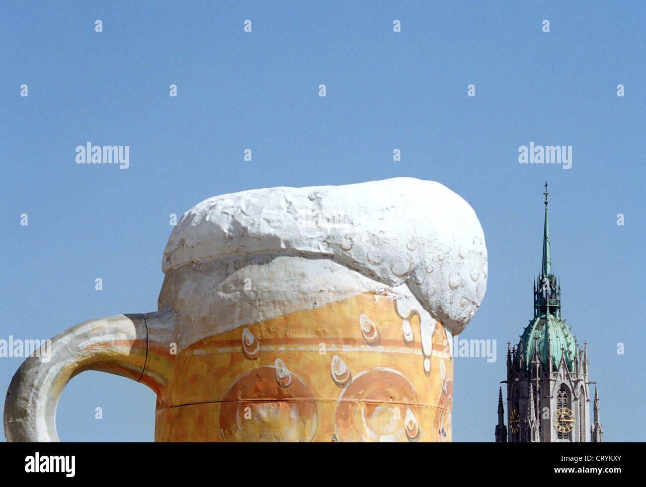 Giant Beer Stein with beer and a steeple on the Wiesn Stock Photo - Alamy