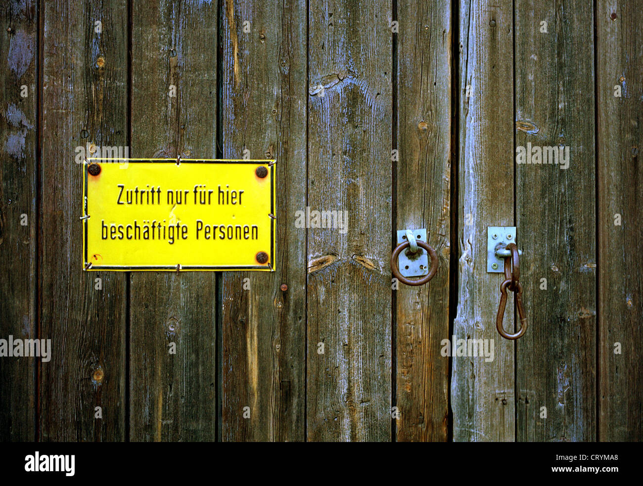 Warning sign on a wooden gate, Berlin Stock Photo