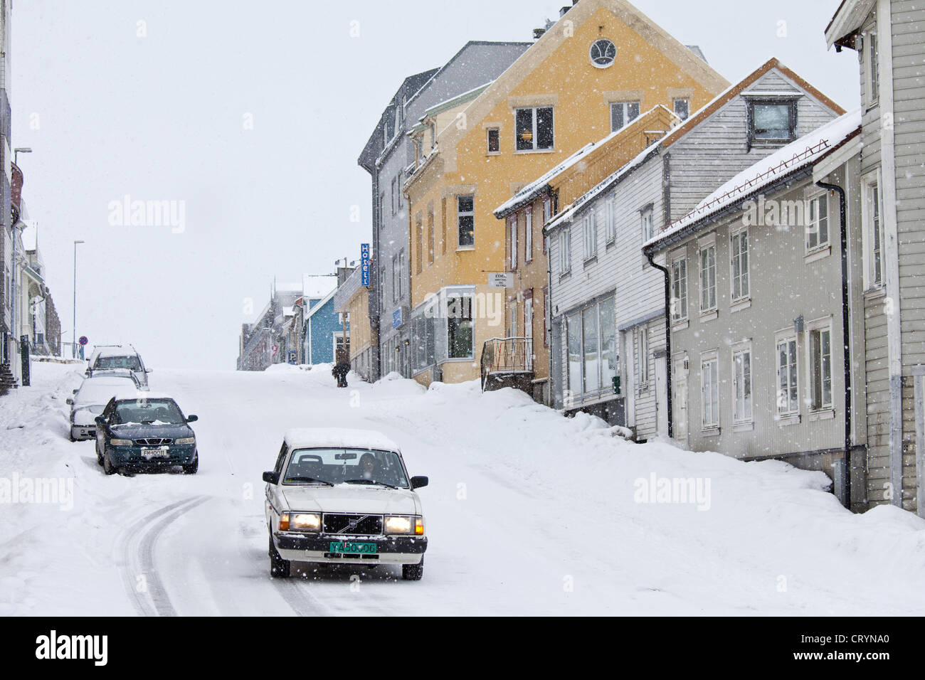 Volvo with winter tyres driving in snowy conditions in Tromso within the Arctic Circle in Northern Norway Stock Photo