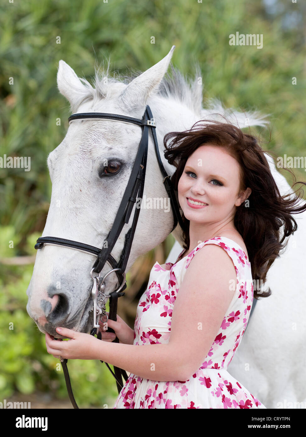 Young woman with horse Stock Photo
